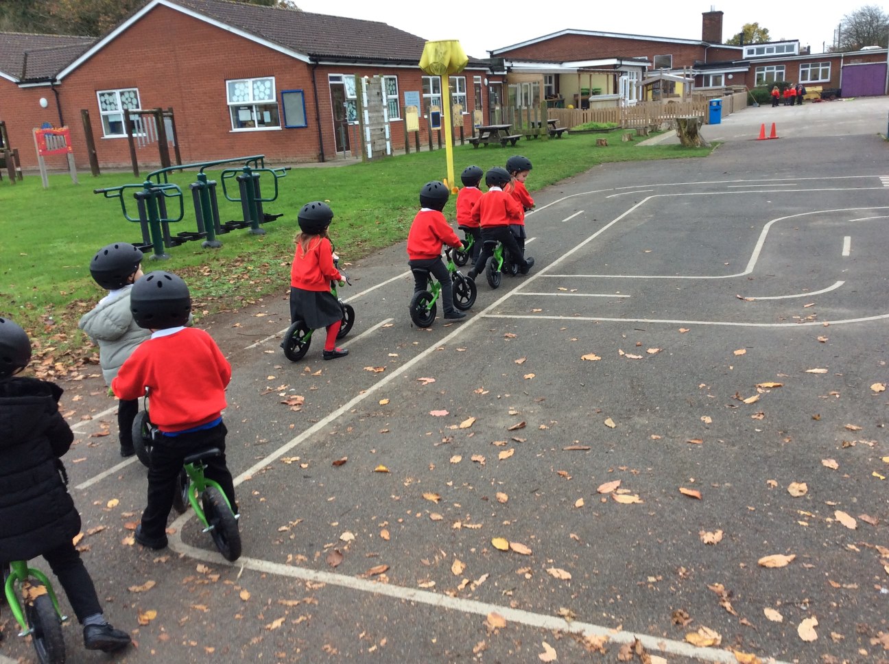 children on bikes in playground