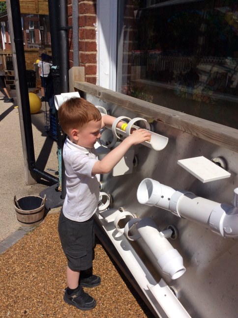 children playing with tubes