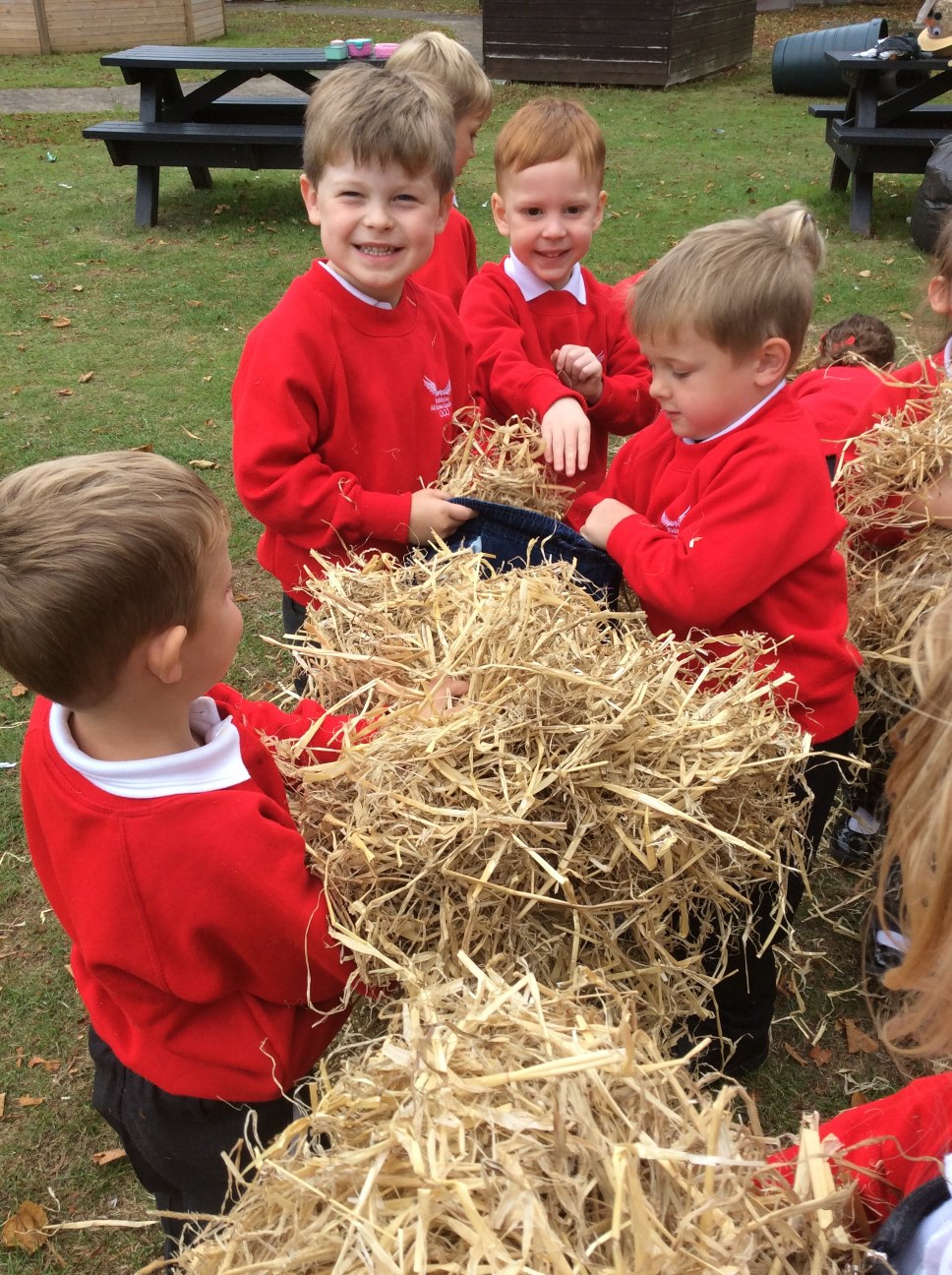 children with hay bale